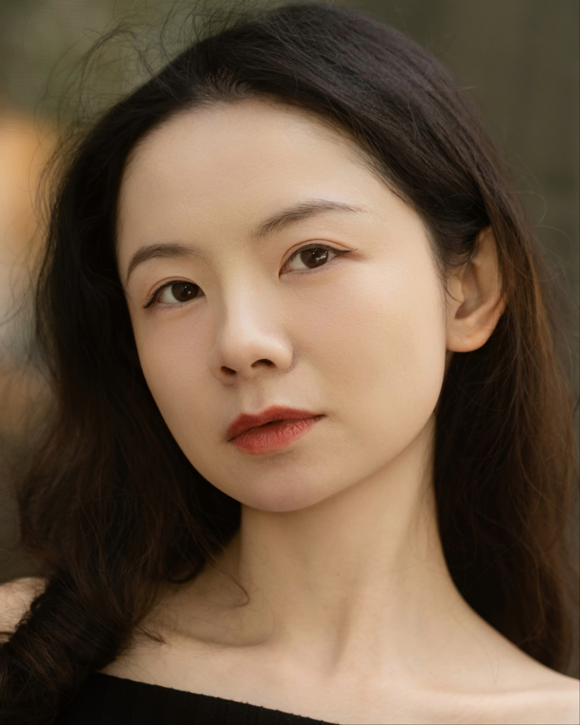 Leighton Zhang headshot with a direct gaze