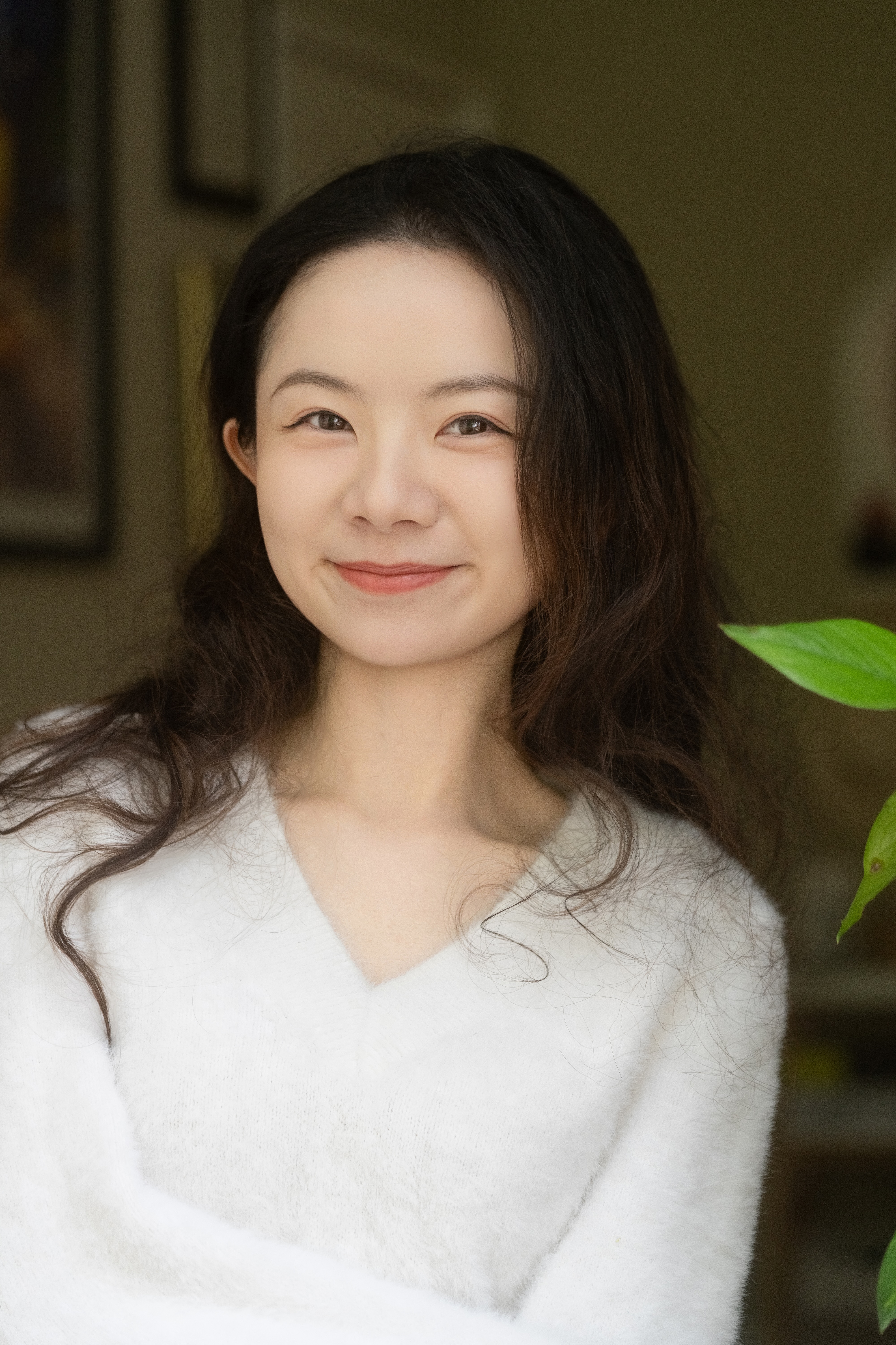 Leighton Zhang headshot in a three-quarter portrait